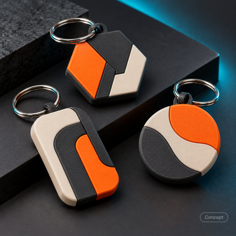 Concept of three geometric multi-color printed keychains with metal rings.